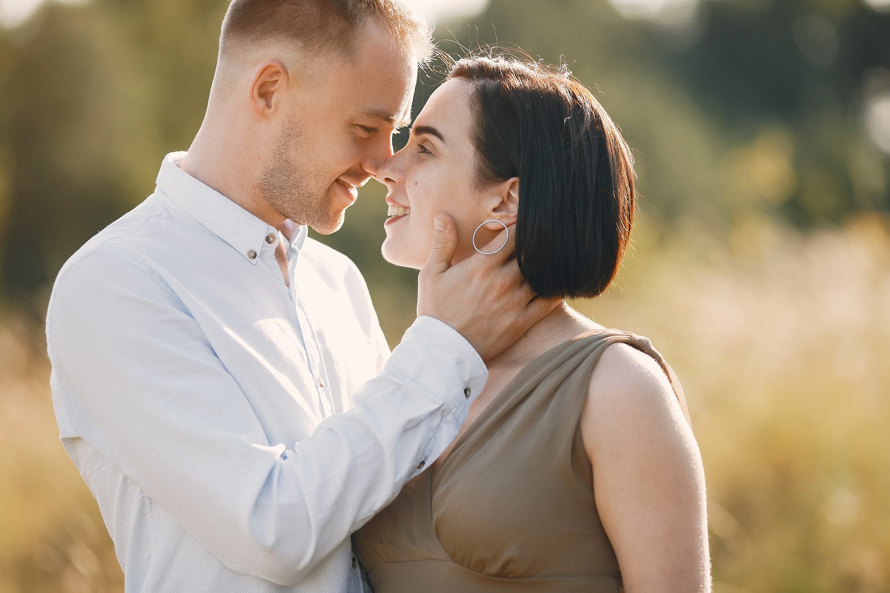 A couple sharing a warm moment outdoors