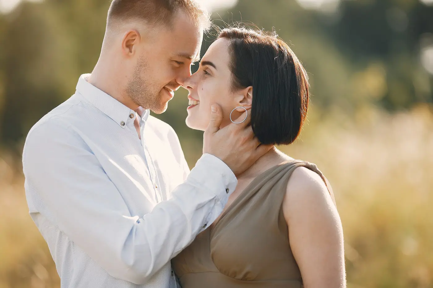 A couple sharing a warm moment outdoors